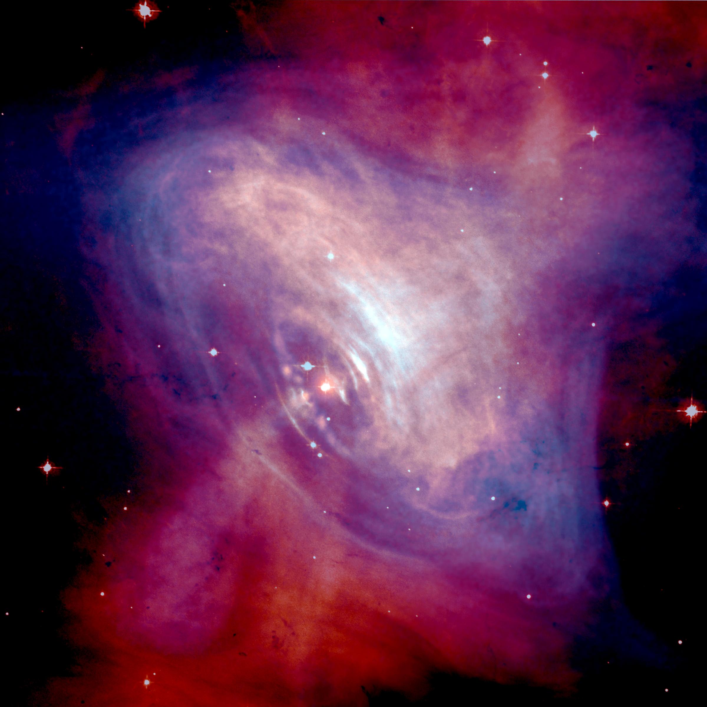 Chandra X-ray and Hubble optical composite of the Crab Nebula showing the pulsar at center