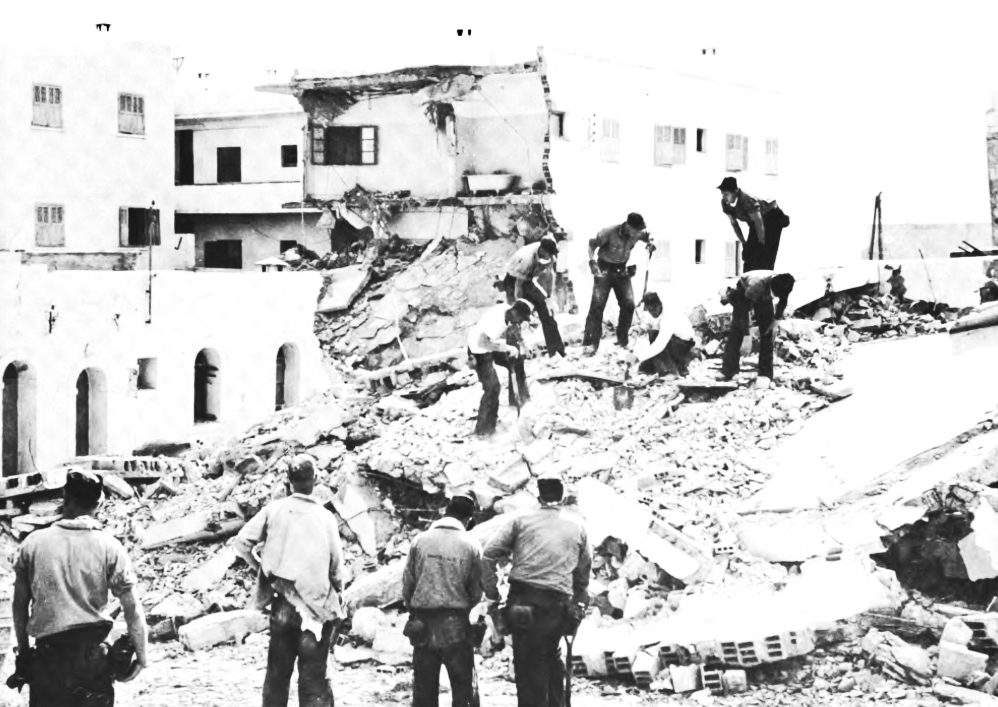 Rescue workers searching collapsed buildings in the Talborjt district of Agadir, 1960