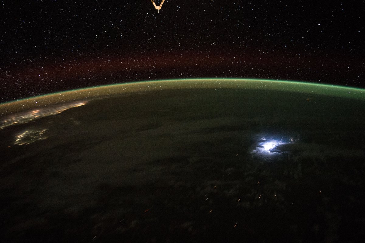 Lightning seen from orbit aboard the International Space Station, looking down at a storm over the ocean