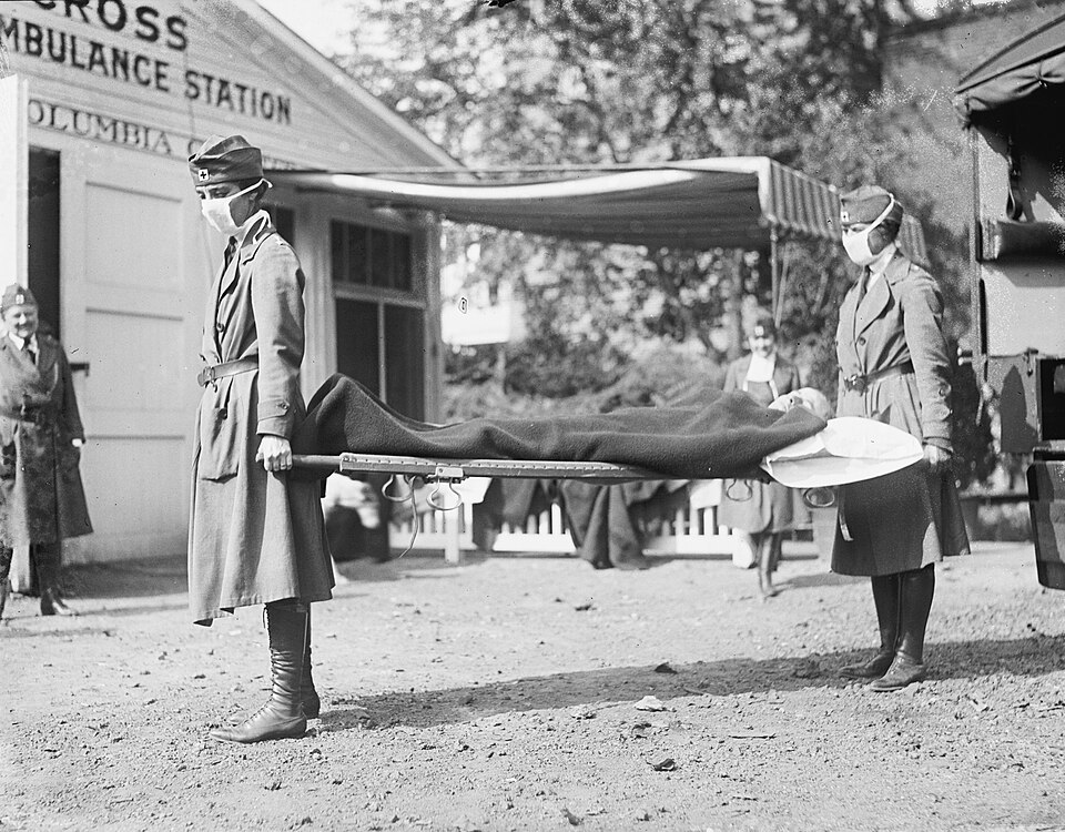 Red Cross demonstration at the Emergency Ambulance Station in Washington D.C. during the 1918 influenza pandemic, workers wearing masks