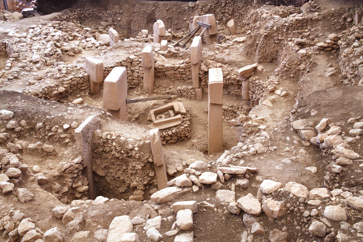 T-shaped limestone pillars in Enclosure B at Göbekli Tepe, showing the scale of the central pillars and their carved reliefs