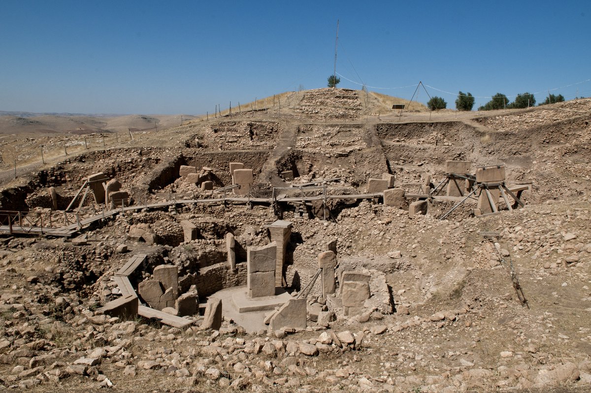 View over the Göbekli Tepe site from the ridge, showing the excavated enclosures and the surrounding plain