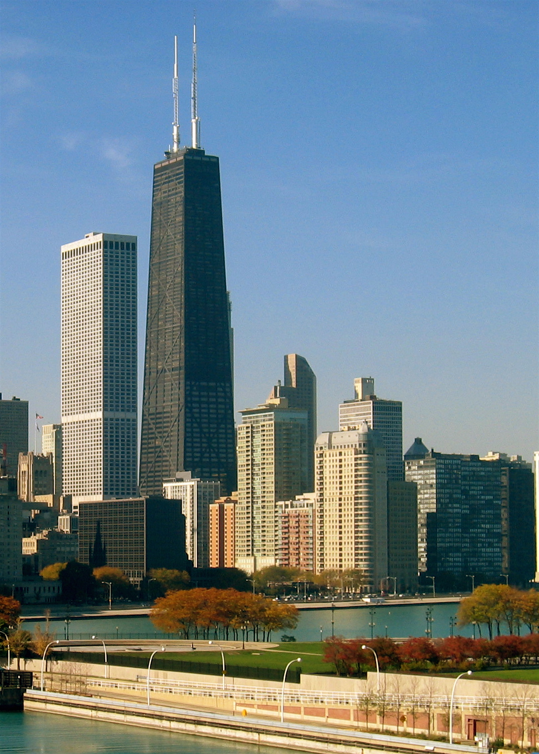 The John Hancock Center in Chicago, photographed from Navy Pier, showing the twin broadcast antenna towers on top
