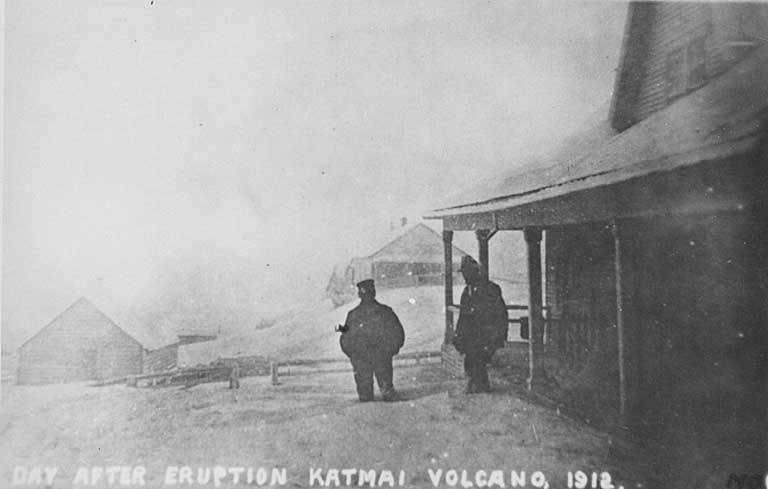 Two men standing in volcanic ash from the Katmai eruption, Kodiak, Alaska, June 7, 1912
