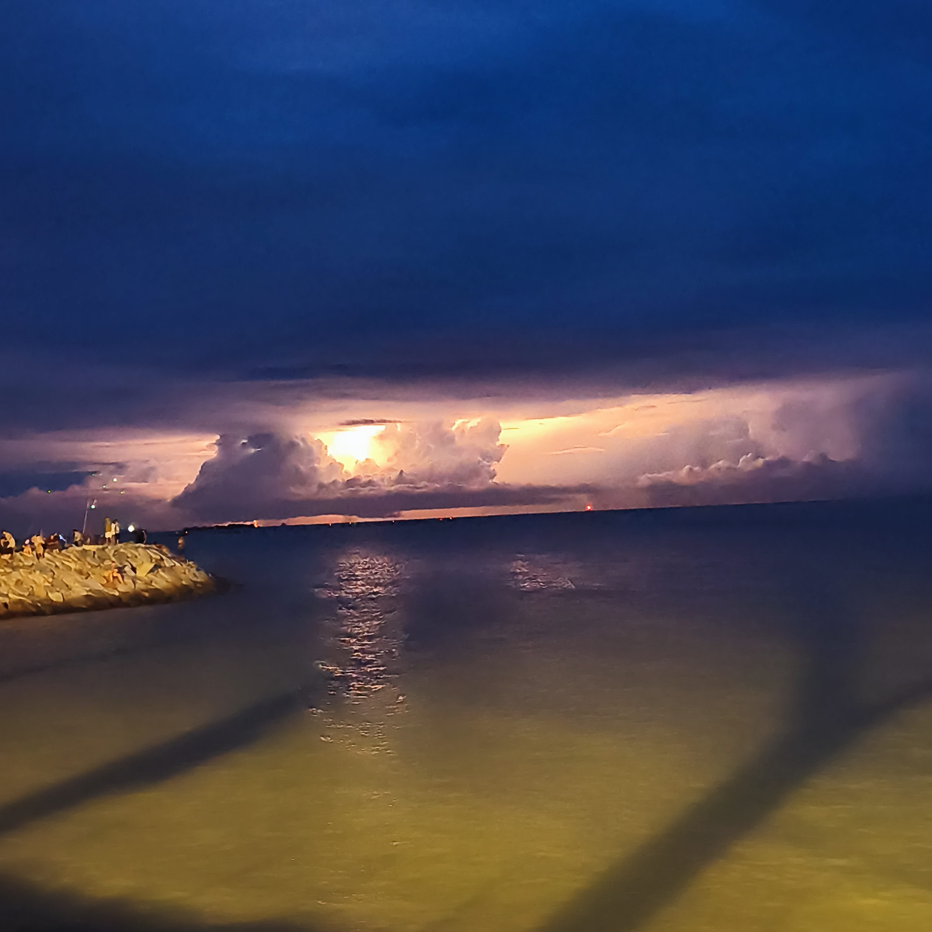 Thunderstorm building over the Strait of Malacca at dusk