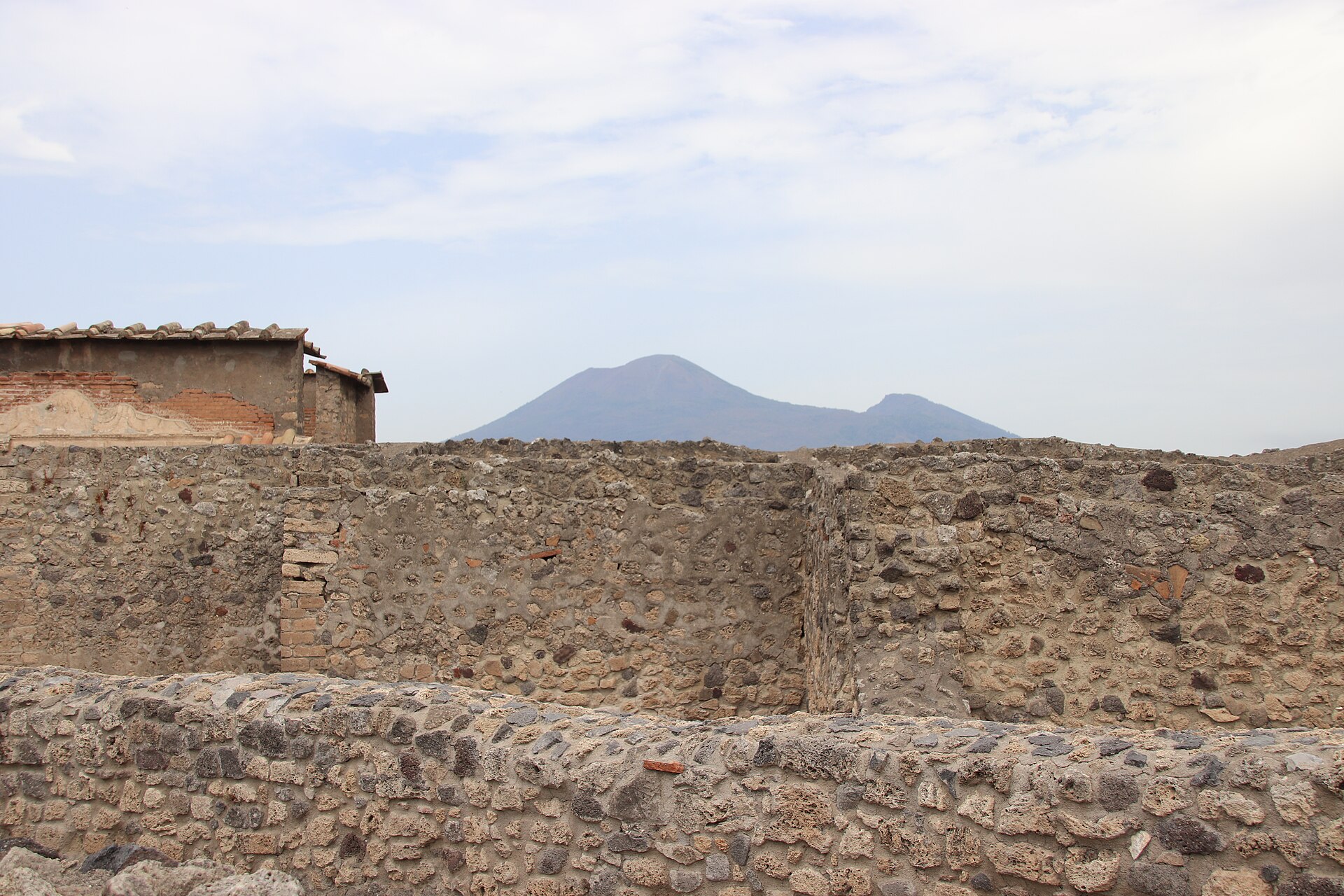 The excavated streets of Pompeii with Mount Vesuvius in the background