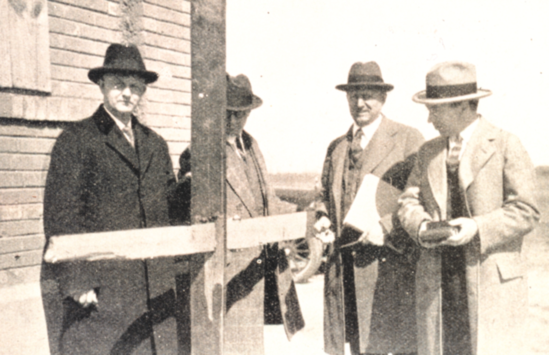 Engineering committee examining a 1x5 inch board driven through a 2x6 inch plank by the 1925 Tri-State Tornado